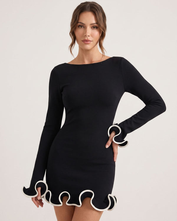Vestido de punto con dobladillo ondulado y silueta fluida