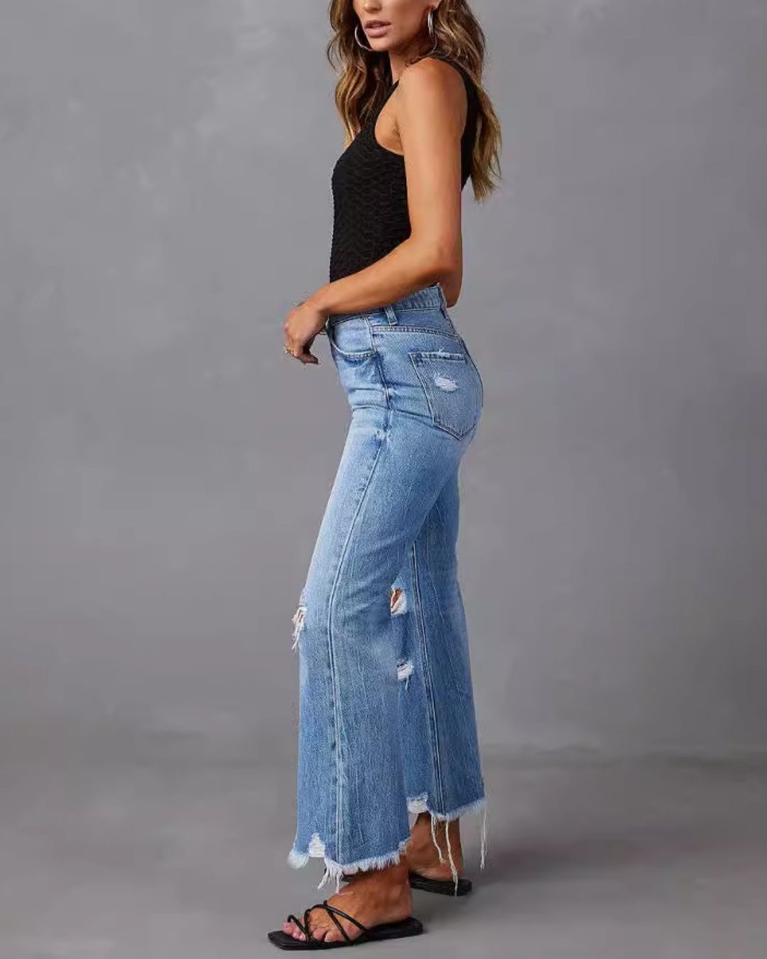 Jeans a zampa d'elefante a vita media effetto distressed